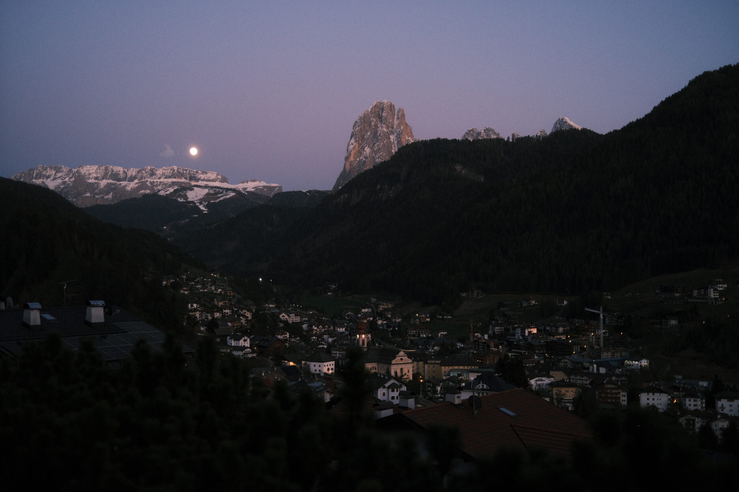 Dolomites at dusk, moonrise over Ortisei
